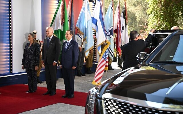 US President Joe Biden (2nd-L) is welcomed by President Isaac Herzog (3rd-L), and First Lady Michal (L), to the President's Residence in Jerusalem on July 14, 2022. (Photo by MANDEL NGAN / AFP)