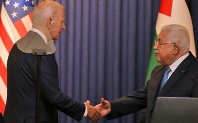US President Joe Biden and Palestinian Authority President Mahmoud Abbas shake hands after their statements to the media at the Muqataa Presidential Compound in the city of Bethlehem in the West Bank on July 15, 2022. (Ahmad Gharabli/AFP)