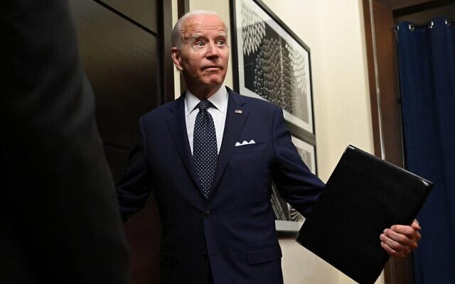 US President Joe Biden exits the room after speaking to the travelling press following a working session with Saudi Arabia's Crown Prince at the Al-Salam Palace in Jeddah, on July 15, 2022. (MANDEL NGAN / AFP) US President Joe Biden exits the room after speaking to the travelling press following a working session with Saudi Arabia's Crown Prince at the Al-Salam Palace in Jeddah, on July 15, 2022. (MANDEL NGAN / AFP)