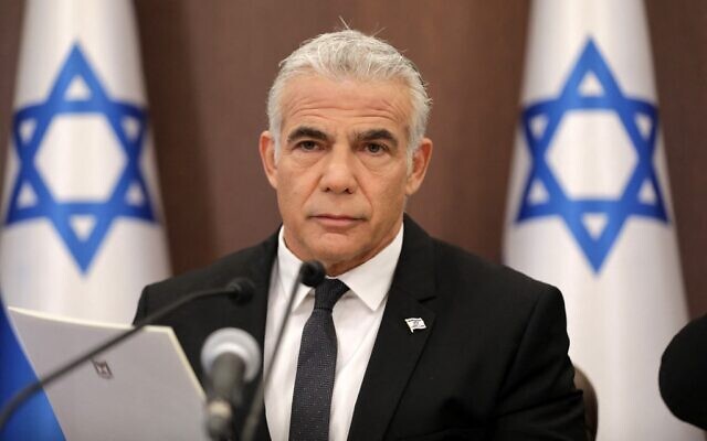 Prime Minister Yair Lapid heads a cabinet meeting at the Prime Minister's Office in Jerusalem, on July 17, 2022 (Abir SULTAN / POOL / AFP) Prime Minister Yair Lapid heads a cabinet meeting at the Prime Minister's Office in Jerusalem, on July 17, 2022 (Abir SULTAN / POOL / AFP)