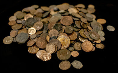Coins taken during the search of a home in Afula, July 7, 2022. (Yoli Schwartz/IAA)