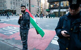 Saadah Masoud, left, a pro-Palestinian activist, shortly before beating a Jewish man on a street in New York City on April 20, 2022. (Luke Tress/Times of Israel)