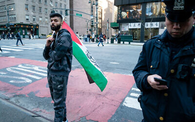 Saadah Masoud, left, a pro-Palestinian activist, shortly before beating a Jewish man on a street in New York City on April 20, 2022. (Luke Tress/Times of Israel)