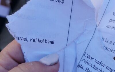 Pages torn from a siddur by young Orthodox men at the egalitarian section of the Western Wall on June 30, 2022. (Masorti Movement)