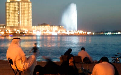 Visitors watch the landmark King Fahd's Fountain in Jeddah, Saudi Arabia on Jan. 15, 2021. (AP Photo/Amr Nabil)