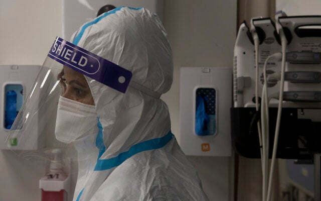 Illustrative image: A medical professional in protective equipment takes a short break, in the coronavirus ward of the Shaare Zedek Medical Center, in Jerusalem, Tuesday, Aug. 31, 2021. (AP Photo/Maya Alleruzzo) Illustrative image: A medical professional in protective equipment takes a short break, in the coronavirus ward of the Shaare Zedek Medical Center, in Jerusalem, Tuesday, Aug. 31, 2021. (AP Photo/Maya Alleruzzo)