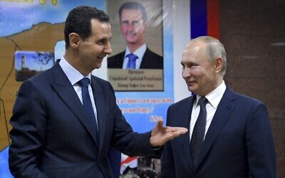 File - Then-Syrian president Bashar Assad (left) and Russian President Vladimir Putin, in Damascus, Syria, January 7, 2020. (Alexei Druzhinin, Sputnik, Kremlin Pool Photo via AP)