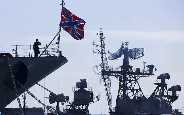A Russian sailor salutes on the bow of Missile Cruiser Moskva, left, as crew of Russian patrol ship Pitliviy, right, prepare to moor the vessel, in Sevastopol, Crimea, March 30, 2014. (AP Photo/Pavel Golovkin, File) A Russian sailor salutes on the bow of Missile Cruiser Moskva, left, as crew of Russian patrol ship Pitliviy, right, prepare to moor the vessel, in Sevastopol, Crimea, March 30, 2014. (AP Photo/Pavel Golovkin, File)