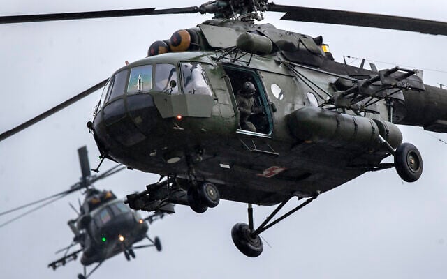 Illustrative: Russian-made Polish Army helicopters MI-17 take part in the NATO military exercise 'Flaming Sword 2022' at a training range near the village Maisiejunai, some 96 km (59 miles) west of the capital Vilnius, Lithuania, May 12, 2022. (AP Photo/Mindaugas Kulbis) Illustrative: Russian-made Polish Army helicopters MI-17 take part in the NATO military exercise 'Flaming Sword 2022' at a training range near the village Maisiejunai, some 96 km (59 miles) west of the capital Vilnius, Lithuania, May 12, 2022. (AP Photo/Mindaugas Kulbis)