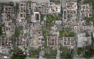 An aerial view of a residential area ruined by the Russian shelling in Irpin close to Kyiv, Ukraine, Saturday, May 21, 2022. (AP Photo/Efrem Lukatsky)