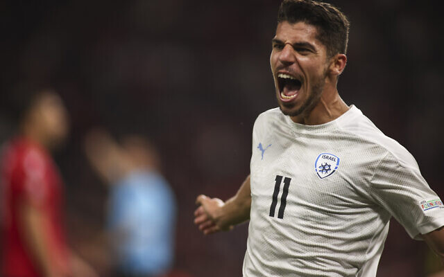 Israel's Manor Solomon celebrates, after scoring his side second goal against Albania, during the UEFA Nations League soccer match between Albania and Israel at Air Albania stadium in Tirana, Albania, on June 10, 2022. (AP Photo/Franc Zhurda)