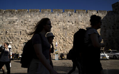Tourists visit the Old City of Jerusalem, Wednesday, June 15, 2022. (AP Photo/Maya Alleruzzo) Tourists visit the Old City of Jerusalem, Wednesday, June 15, 2022. (AP Photo/Maya Alleruzzo)