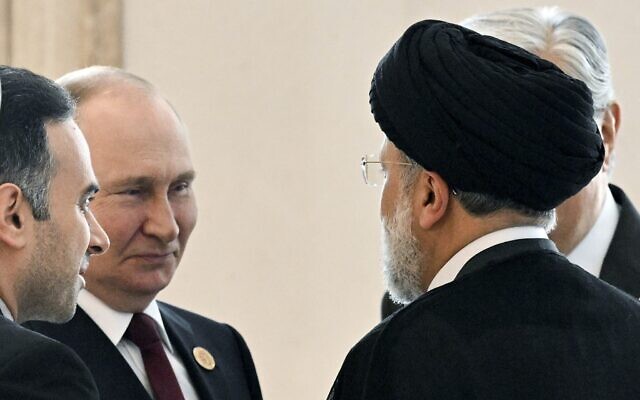 Russian President Vladimir Putin, left, speaks to Iran's President Ebrahim Raisi, back to a camera, on the sideline of the summit of Caspian Sea littoral states in Ashgabat, Turkmenistan, June 29, 2022. (Grigory Sysoyev, Sputnik, Kremlin Pool Photo via AP, File) Russian President Vladimir Putin, left, speaks to Iran's President Ebrahim Raisi, back to a camera, on the sideline of the summit of Caspian Sea littoral states in Ashgabat, Turkmenistan, June 29, 2022. (Grigory Sysoyev, Sputnik, Kremlin Pool Photo via AP, File)