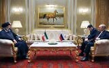 Illustrative: Russian President Vladimir Putin, right, speaks to Iran's President Ebrahim Raisi on the sideline of the summit of Caspian Sea littoral states in Ashgabat, Turkmenistan, June 29, 2022. (Mikhail Klimentyev, Sputnik, Kremlin Pool Photo via AP, File)