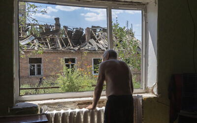 Victor Rosenberg, 81, looks out of a broken window in his home destroyed by the Russian rocket attack in the city center of Bakhmut, Donetsk region, Friday, July 1, 2022. (AP Photo/Efrem Lukatsky) Victor Rosenberg, 81, looks out of a broken window in his home destroyed by the Russian rocket attack in the city center of Bakhmut, Donetsk region, Friday, July 1, 2022. (AP Photo/Efrem Lukatsky)