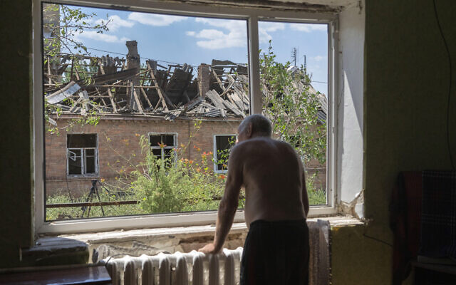 Victor Rosenberg, 81, looks out of a broken window in his home destroyed by the Russian rocket attack in the city center of Bakhmut, Donetsk region, Friday, July 1, 2022. (AP Photo/Efrem Lukatsky) Victor Rosenberg, 81, looks out of a broken window in his home destroyed by the Russian rocket attack in the city center of Bakhmut, Donetsk region, Friday, July 1, 2022. (AP Photo/Efrem Lukatsky)