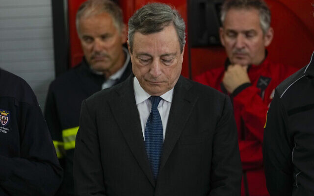 Italian Prime Minister Mario Draghi, center, attends a press conference in Canazei, in the Italian Alps in northern Italy, July 4, 2022. (AP Photo/Luca Bruno) Italian Prime Minister Mario Draghi, center, attends a press conference in Canazei, in the Italian Alps in northern Italy, July 4, 2022. (AP Photo/Luca Bruno)