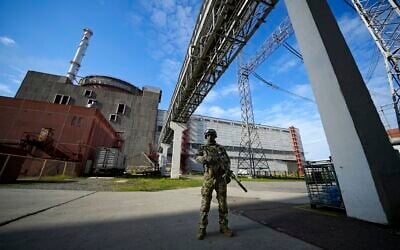 A Russian serviceman guards in an area of the Zaporizhzhia Nuclear Power Station in territory under Russian military control, southeastern Ukraine, Sunday, May 1, 2022. (AP Photo, File)