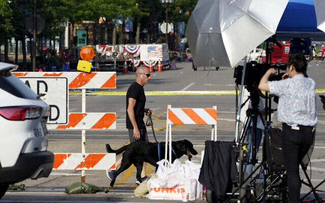 A barricade in place the day after after a mass shooting in the northern Chicago suburb of Highland Park, July 5, 2022. (AP Photo/Charles Rex Arbogast) A barricade in place the day after after a mass shooting in the northern Chicago suburb of Highland Park, July 5, 2022. (AP Photo/Charles Rex Arbogast)