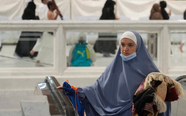 A Muslim pilgrim leaves the Grand Mosque, in Mecca, Saudi Arabia, July 6, 2022. (Amr Nabil/AP) A Muslim pilgrim leaves the Grand Mosque, in Mecca, Saudi Arabia, July 6, 2022. (Amr Nabil/AP)