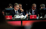 US Secretary of State Antony Blinken, left, attends a meeting at the G20 Foreign Ministers' Meeting in Nusa Dua on the Indonesian resort island of Bali, July 8, 2022. (Stefani Reynolds/Pool Photo via AP)