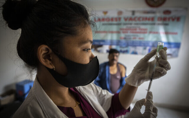 A nurse prepares to administer vaccine for COVID-19 at a private vaccination center in Gauhati, India, April 10, 2022. (Anupam Nath/AP) A nurse prepares to administer vaccine for COVID-19 at a private vaccination center in Gauhati, India, April 10, 2022. (Anupam Nath/AP)