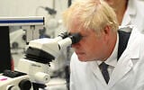 British Prime Minister Boris Johnson visits the Francis Crick Institute in London, Monday, July 11, 2022.  (Leon Neal/Pool via AP)