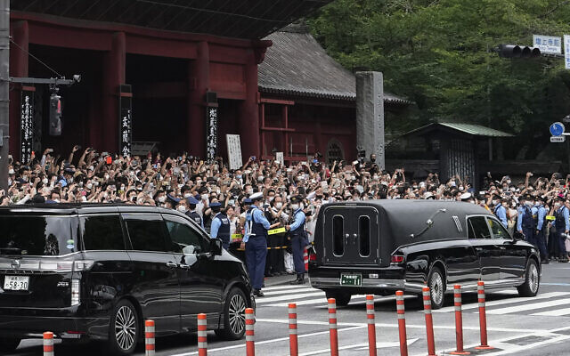 The vehicle, right, carrying the body of former Japanese Prime Minister Shinzo Abe leaves Zojoji temple after his funeral in Tokyo on July 12, 2022 (AP Photo/Hiro Komae) The vehicle, right, carrying the body of former Japanese Prime Minister Shinzo Abe leaves Zojoji temple after his funeral in Tokyo on July 12, 2022 (AP Photo/Hiro Komae)