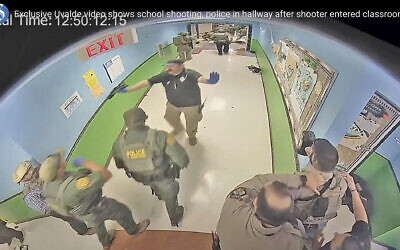 In this photo from surveillance video provided by the Uvalde Consolidated Independent School District via the Austin American-Statesman, authorities respond to the shooting at Robb Elementary School in Uvalde, Texas, Tuesday, May 24, 2022. (Uvalde Consolidated Independent School District/Austin American-Statesman via AP)