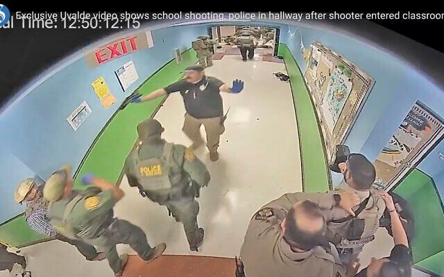 In this photo from surveillance video provided by the Uvalde Consolidated Independent School District via the Austin American-Statesman, authorities respond to the shooting at Robb Elementary School in Uvalde, Texas, Tuesday, May 24, 2022. (Uvalde Consolidated Independent School District/Austin American-Statesman via AP) In this photo from surveillance video provided by the Uvalde Consolidated Independent School District via the Austin American-Statesman, authorities respond to the shooting at Robb Elementary School in Uvalde, Texas, Tuesday, May 24, 2022. (Uvalde Consolidated Independent School District/Austin American-Statesman via AP)