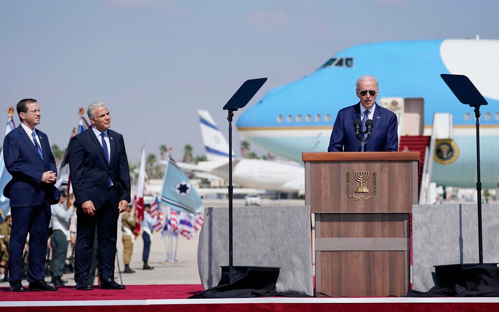 President Joe Biden speaks after arriving at Ben Gurion Airport, Wednesday, July 13, 2022, as Israeli Prime Minister Yair Lapid, second left, and President Isaac Herzog, left, look on. (AP Photo/Evan Vucci) President Joe Biden speaks after arriving at Ben Gurion Airport, Wednesday, July 13, 2022, as Israeli Prime Minister Yair Lapid, second left, and President Isaac Herzog, left, look on. (AP Photo/Evan Vucci)