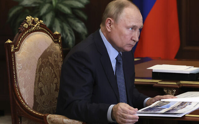 Russian President Vladimir Putin attends a meeting at the Kremlin in Moscow, Russia, Wednesday, July 13, 2022. (Mikhail Klimentyev/Sputnik, Kremlin Pool Photo via AP) Russian President Vladimir Putin attends a meeting at the Kremlin in Moscow, Russia, Wednesday, July 13, 2022. (Mikhail Klimentyev/Sputnik, Kremlin Pool Photo via AP)