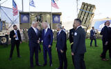 US President Joe Biden shakes hands with Israeli Defense Minister Benny Gantz, as he is shown aerial defense systems, Wednesday, July 13, 2022, in Tel Aviv, as then Prime Minister Yair Lapid, right of Biden, looks on. (AP/Evan Vucci)