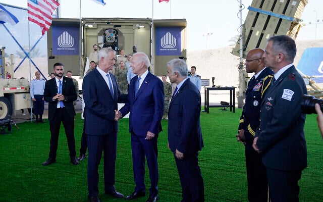 US President Joe Biden talks with Defense Minister Benny Gantz, left, and Prime Minister Yair Lapid, right, as he is shown views of aerial defense systems, July 13, 2022, in Tel Aviv. (AP Photo/Evan Vucci) US President Joe Biden talks with Defense Minister Benny Gantz, left, and Prime Minister Yair Lapid, right, as he is shown views of aerial defense systems, July 13, 2022, in Tel Aviv. (AP Photo/Evan Vucci)