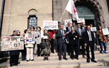 Supporters of the People's Mujahedin Organization of Iran protest outside Stockholm's district court on the first day of the trial of Hamid Noury, in Stockholm, August 10, 2021. (Stefan Jerrevang/TT News Agency via AP, File)