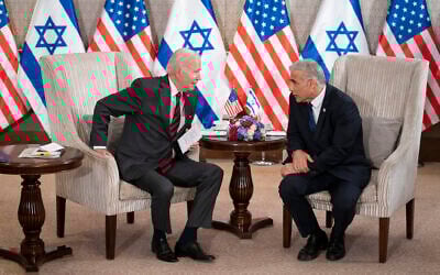 US President Joe Biden, left, and Prime Minister Yair Lapid address the media following their meeting in Jerusalem, July 14, 2022. (AP Photo/Evan Vucci)