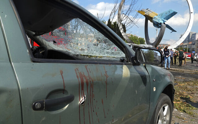 Blood stains are seen on a damaged car after a deadly Russian missile attack in Vinnytsia, Ukraine, July 14, 2022 (AP Photo/Efrem Lukatsky, File) Blood stains are seen on a damaged car after a deadly Russian missile attack in Vinnytsia, Ukraine, July 14, 2022 (AP Photo/Efrem Lukatsky, File)