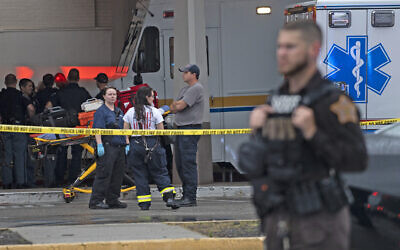 Emergency personnel gather after a deadly shooting Sunday, July 17, 2022, at the Greenwood Park Mall, in Greenwood, Ind. (Kelly Wilkinson/The Indianapolis Star via AP)