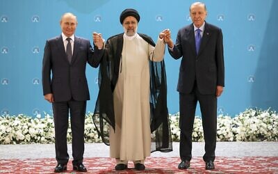 Russian President Vladimir Putin, left, Turkish President Recep Tayyip Erdogan, right, and Iran's late President Ebrahim Raisi pose for a photo at the Saadabad palace in Tehran, Iran, July 19, 2022. (Sergei Savostyanov, Sputnik, Kremlin Pool Photo via AP)