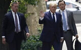 Former US president Donald Trump, center, waves as he arrives for the funeral for his ex-wife Ivana Trump, in New York, July 20, 2022. (John Minchillo/AP)