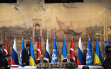 Turkish President Recep Tayyip Erdogan, center right, and UN Secretary-General Antonio Guterres lead a signing ceremony at Dolmabahce Palace in Istanbul, Turkey, Friday, July 22, 2022, flanked by representatives from Russia and Ukraine at the ends of the table. (AP/Khalil Hamra)