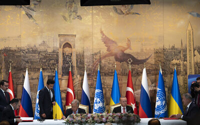Turkish President Recep Tayyip Erdogan, center right, and UN Secretary-General Antonio Guterres lead a signing ceremony at Dolmabahce Palace in Istanbul, Turkey, Friday, July 22, 2022, flanked by representatives from Russia and Ukraine at the ends of the table. (AP/Khalil Hamra)