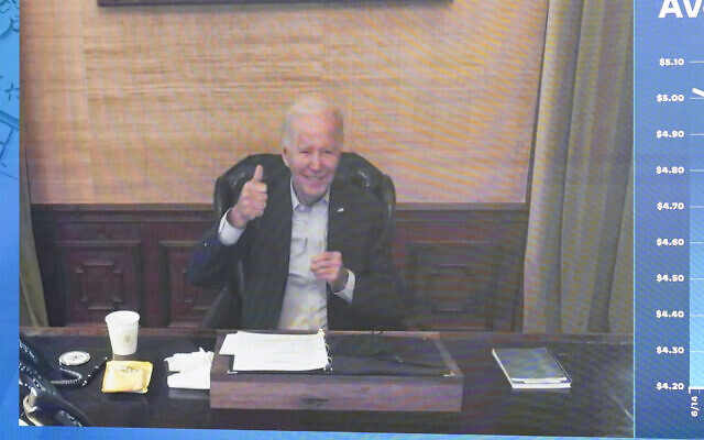 US President Joe Biden gives a thumbs-up after being asked by members of the media how he is feeling, as he speaks virtually during a meeting with his economic team in the South Court Auditorium on the White House complex in Washington, July 22, 2022. (AP Photo/Andrew Harnik) US President Joe Biden gives a thumbs-up after being asked by members of the media how he is feeling, as he speaks virtually during a meeting with his economic team in the South Court Auditorium on the White House complex in Washington, July 22, 2022. (AP Photo/Andrew Harnik)