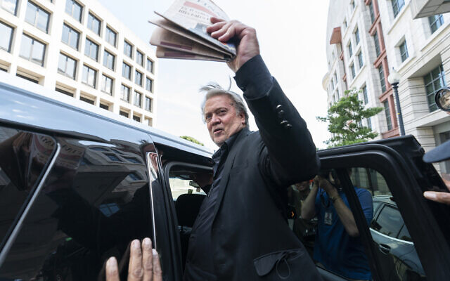 Former White House strategist Steve Bannon waves to the crowd as he departs federal court on Friday, July 22, 2022, in Washington. (AP/Alex Brandon)