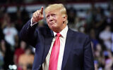 Former US president Donald Trump points to the crowd as he arrives to speak at a rally in Prescott, Arizona, July 22, 2022. (Ross D. Franklin/AP)