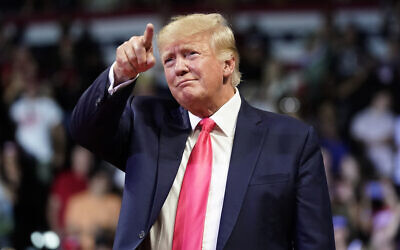 Former US president Donald Trump points to the crowd as he arrives to speak at a rally in Prescott, Arizona, July 22, 2022. (Ross D. Franklin/AP)