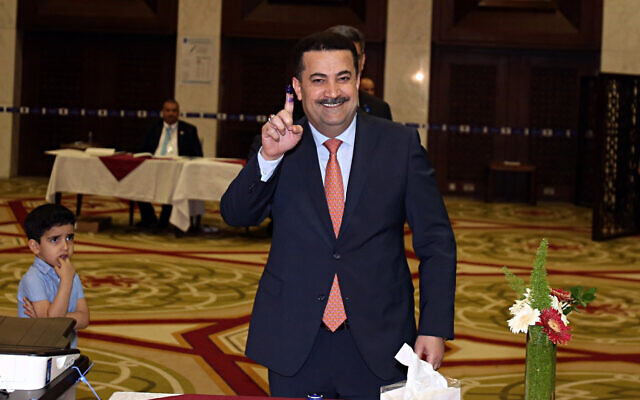 Mohammed al-Sudani, Minister of Labor and Social Affairs, shows his ink-stained finger after casting his vote in the country's parliamentary elections in the heavily fortified Green Zone in Baghdad, Iraq, May 12, 2018. (AP/Karim Kadim, File) Mohammed al-Sudani, Minister of Labor and Social Affairs, shows his ink-stained finger after casting his vote in the country's parliamentary elections in the heavily fortified Green Zone in Baghdad, Iraq, May 12, 2018. (AP/Karim Kadim, File)