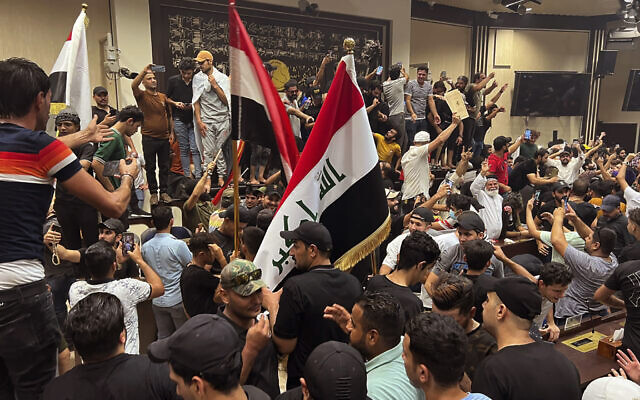 Iraqi protesters demonstrate inside the country's parliament in Baghdad, Iraq, Wednesday, July. 27, 2022. (AP/Ali Jabar) Iraqi protesters demonstrate inside the country's parliament in Baghdad, Iraq, Wednesday, July. 27, 2022. (AP/Ali Jabar)