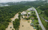 Home and structures are flooded near Quicksand, Kentucky, July 28, 2022. (Ryan C. Hermens/Lexington Herald-Leader via AP)