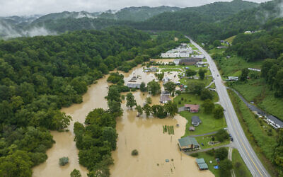 Home and structures are flooded near Quicksand, Kentucky, July 28, 2022. (Ryan C. Hermens/Lexington Herald-Leader via AP)